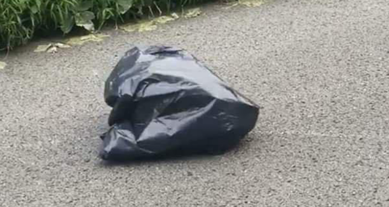 Woman Swerves To Miss Trash Bag In Road, Looks Closer And Gets The Chills