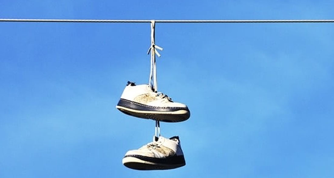 The Meaning Behind Sneakers Hanging from Power Lines